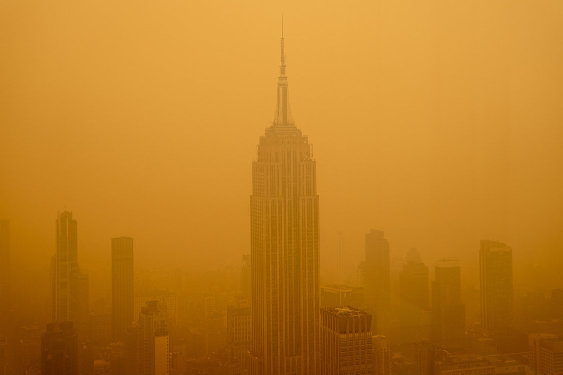 Smoky haze from wildfires in Canada diminishes the visibility of the Empire State Building.
