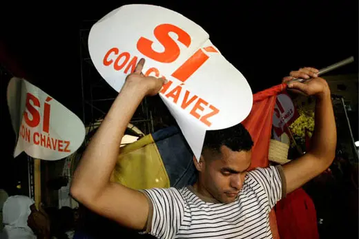 A Chávez supporter outside the Miraflores presidential palace in Caracas. Daniel Aguilar/Reuters
