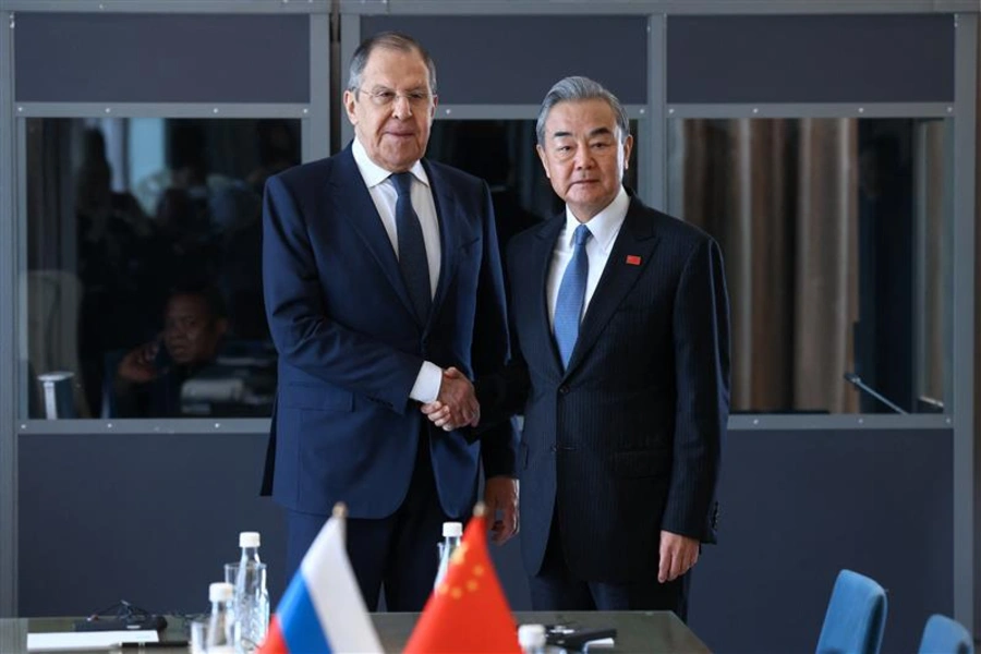 Russian Foreign Minister Sergei Lavrov shakes hands with Chinese Foreign Minister Wang Yi during a meeting on the sidelines of the Group of Twenty (G20) Summit. Russian Foreign Ministry/Reuters.