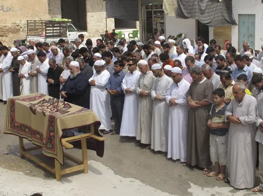 Residents attend the funeral of a sergeant whom defected to join the Free Syrian Army on the outskirts of Idlib province