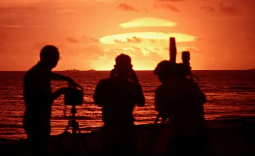 Photo showing Photographers and camera crew filming nuclear tests conducted by the United States in 1958. 