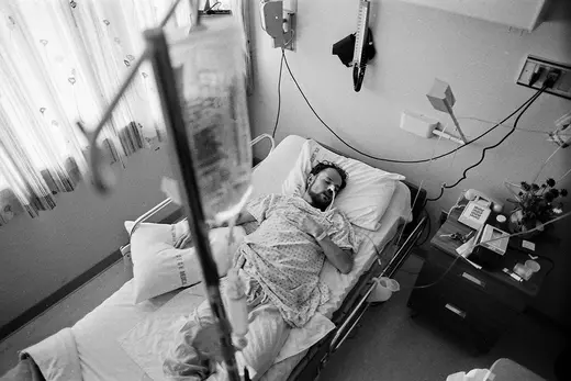 Deotis McMather, an AIDS patient, sleeps in his bed at a San Francisco hospital in 1983.