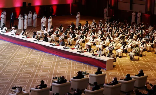 Delegates from the Afghan government and the Taliban attend talks in Doha.