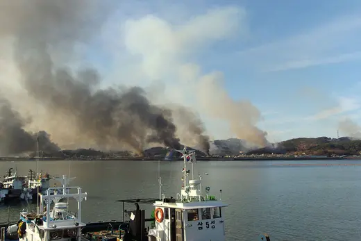 Smoke rises from Yeonpyeong after North Korean artillery hit the South Korean island.