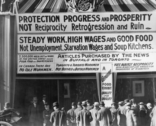 Anti-reciprocity signs hang from the building of The News, an evening newspaper in Toronto, Ontario.